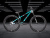 The Bruce 2 Frameguard dirt jump bike med teal, sort og hvid geometrisk “Stripo” design.